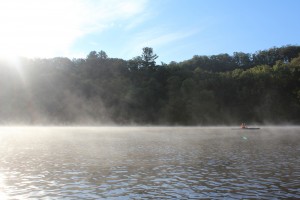 Morning sun, mist, and a kayaker on the St. Croix River Morning sun, mist, and a kayaker on the St. Croix River