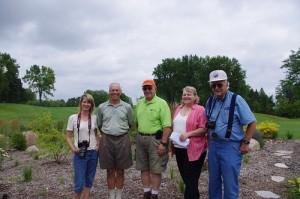 BCWD Manager Connie Taillon, SCC Member Paul Spilseth, BCWD Manager Craig Leiser, BCWD Manager Gail Pundsack and BCWD Manager Rick Vanzwol in front of a recently planted raingarden at Stillwater CC. (Photo courtesy Brown's Creek Watershed District)