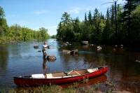 A "watery embrace" A canoe and fisherman on the upper St. Croix River