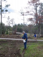 Citizen stewards spreading native seeds at Riverside Landing on 10/14.