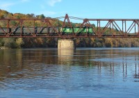 An Osceola & St. Croix Valley train crosses the St. Croix River on the Cedar Bend Bridge 