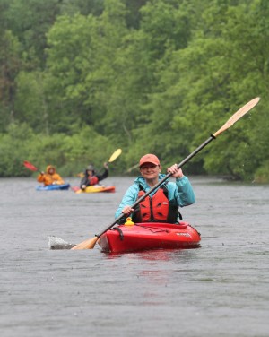 St. Croix River Association executive director Deb Ryun kayaks down the Namekagon during the 2013 paddle.