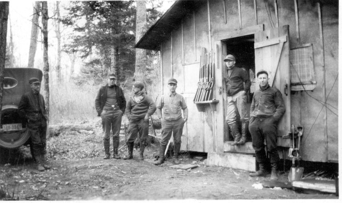 A hunting party at their hunting shack near Cable, Wisconsin (Riegel Historic Collection)