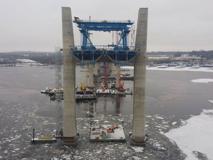 View of Pier 12, closest to Wisc. land. Tug boats are breaking ice within the bridge construction zone and downstream near Bayport to keep the waterway open. Crews can only access Piers 10 and 11 in the middle of the river by boat. Tower construction continues at these pier locations.