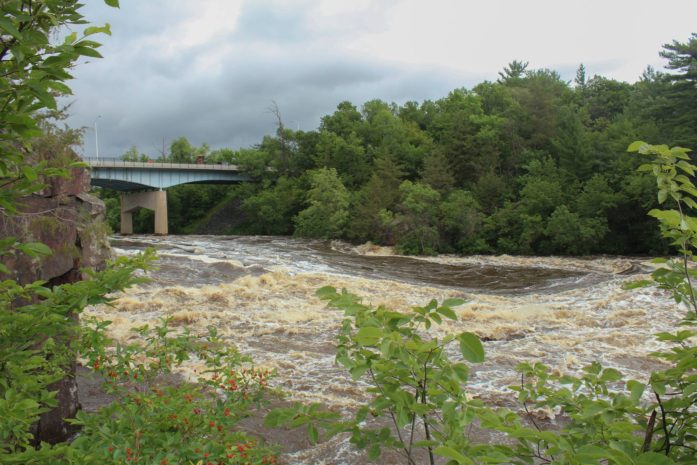 Flood waters rushing through the Dalles. (National Park Service photo)