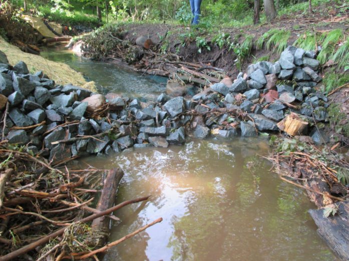 A rock dam controls and slows water, reducing its power to erode and carry soil and other material. (Photo Chisago Soil & Water Conservation District) 