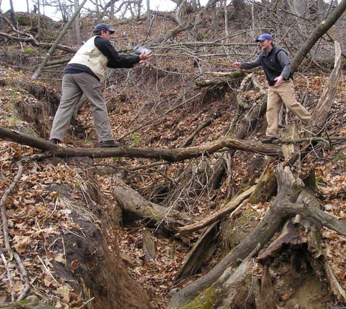 Measuring the gully in 2011. (Photo courtesy Carnelian-Marine-St. Croix Watershed District)