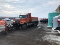 Snowplows spread beet product to melt ice, cut pollution, and reduce road repair costs
