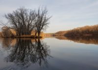 Canoeing down a river getting ready for winter